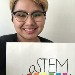 Person with oSTEM sign